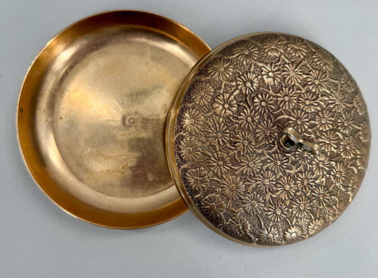 Korean brass covered box with a floral relief lid